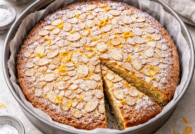 golden almond cake dusted with powdered sugar