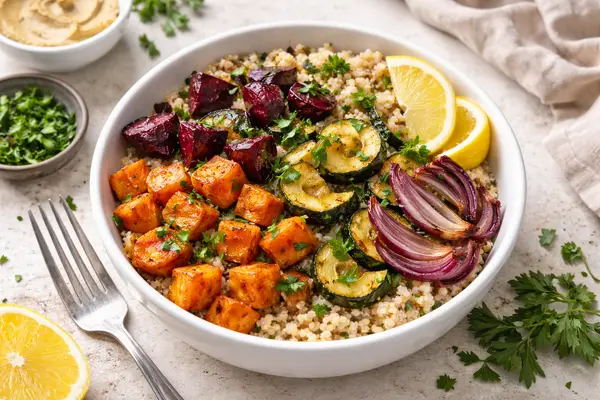 quinoa bowl topped with roasted vegetables